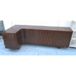 CORNER SIDEBOARD, Art Deco style, Macassar wood, with three cupboards and five drawers,