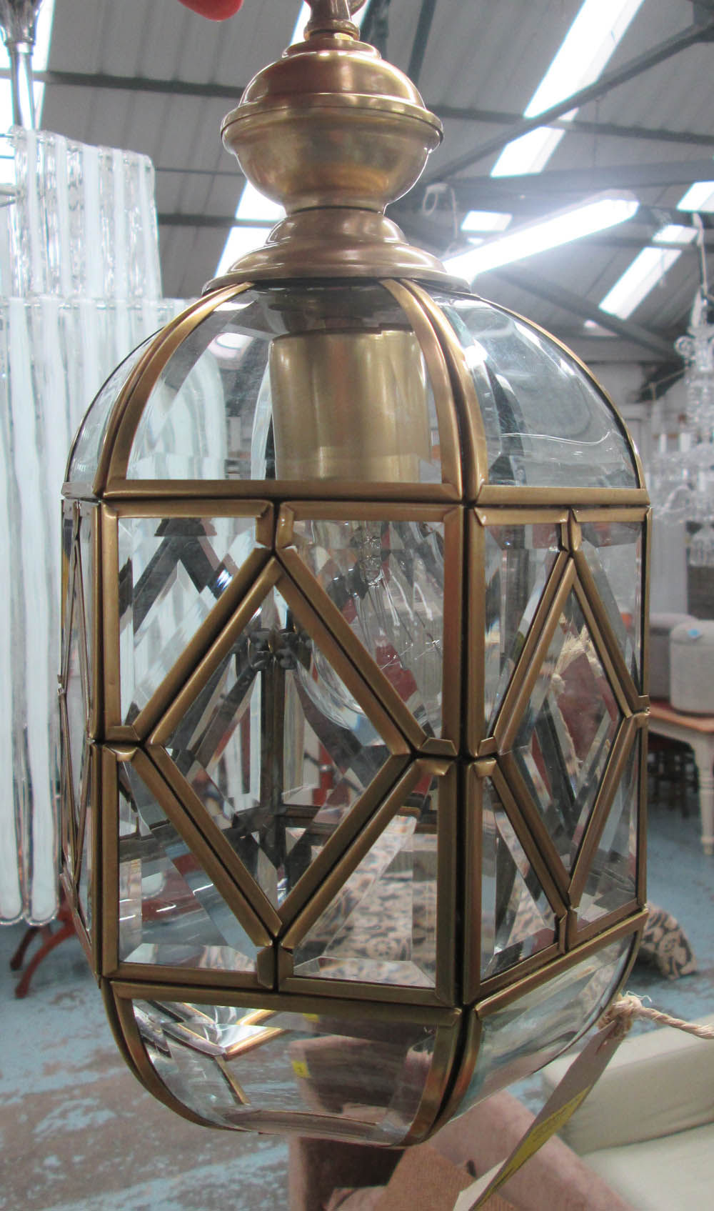 CEILING LIGHT, with bevelled glass, in a brass effect frame, 35cm H plus chain.