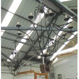 CHANDELIERS, a pair, of bespoke handforged wrought iron, 108cm x 102cm.