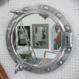 ORIGINAL SHIPS PORTHOLE, with mirror polished metal surrounds with catchs, wall fixings attached,
