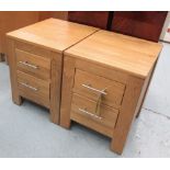 BEDSIDE CHESTS, a pair, contemporary oak, each with two drawers, 56cm H x 47cm W x 41cm D.