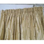 CURTAINS, a pair, in gold coloured silk with fern decoration, lined and interlined,