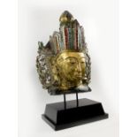 BUDDHA BUST, Thai, gilt carved wood the headdress ornamented with coloured glass,