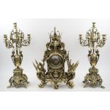 CLOCK GARNITURE, of Roccoco inspiration, ornate brass, quartz movement, 63cm H (clock),