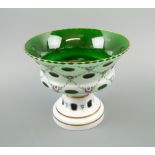 BOHEMIAN GLASS BOWL, white enamel on green glass, with slice cut and floral trellis decoration, 19.