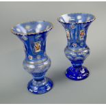 BOHEMIAN BLUE GLASS VASES, a pair, of campana form with foliate painted panels, 22cm H.