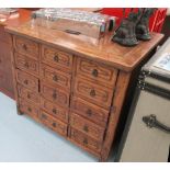 APOTHECARY CHEST, with fifteen small drawers in an Oriental style, hardwood,