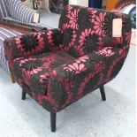 ARMCHAIR, in a black and claret floral fabric, 85cm W x 71cm D x 81cm H.