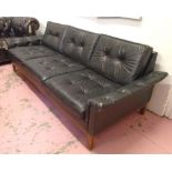 SOFA, 1970's Continental beechwood in black buttoned leather with seat and back cushions,