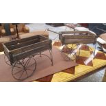 FLOWER PLANTERS, a pair, in the style of a Victorian flower cart, 63cm x 39cm x 33cm.