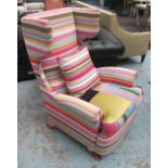 WING ARMCHAIR, upholstered in striped and patchwork fabric, on short velvet sabre supports,