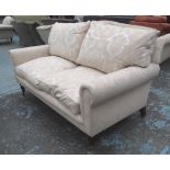 TWO SEATER SOFA, by Recline and Sprawl in a Damask patterned cafe au lait coloured upholstery ,