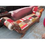 DAYBED, upholstered in patchwork satin, with a carved wooden frame, on paw feet,