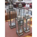 HURRICANE LANTERNS, two pairs, iron in a silvered finish,