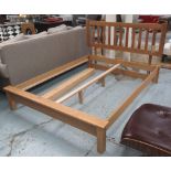 KINGSIZE BED, Contemporary solid oak with slatted base, 166cm W x 211cm L.