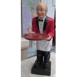 DUMB WAITER FIGURE, supporting a tray, 94cm x 32cm x 54cm.