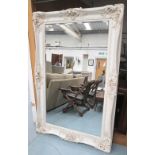 MIRROR, with bevelled plate in ornate white painted frame, 181cm x 119cm.