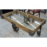 LOW TABLE, Industrial design steel and wood with rectangular glass top on large spoked castors,