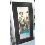 WALL MIRROR, rectangular with broad mitred black ash frame, 190cm x 94cm.