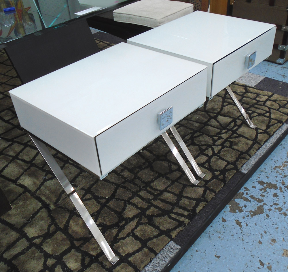 TABLES, a pair, white frosted glass with one draw on chromed supports.