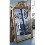 MIRROR, with bevelled plate Louis XV style in ornate gilded frame, 167cm x 90cm.