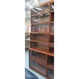 BOOKCASE, mahogany, of seven stacking sections with sliding glass doors,