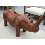 FOOTSTOOL, in the form of a rhinocerous, in tanned leather, 86cm L.