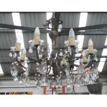 CHANDELIERS, a pair, eight branch, in a silvered metal with faceted glass drops, 60cm x 65cm.