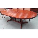 DINING TABLE, rosewood, oval, extending on column supports with triform bases, 275cm L.