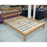 KINGSIZE BED, Contemporary solid oak with slatted base, 166cm W x 211cm L.