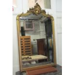 WALL MIRROR, late 19th century French Louis XV style giltwood with bevelled plate and 'C' crest,