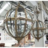 GLOBE CEILING LIGHTS, a pair, in metal and glass in a vintage gold finish.