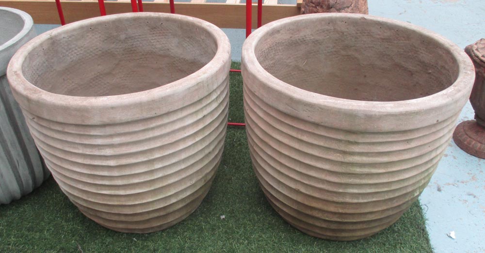 GARDEN POTS, a pair, ribbed design in terracotta, 50cm H x 55cm diam (with faults).