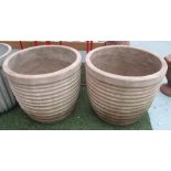 GARDEN POTS, a pair, ribbed design in terracotta, 50cm H x 55cm diam (with faults).