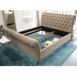 DOUBLE BED, 6ft 6in, in deep buttoned brown alcantara, with chrome studs.