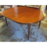 DINING TABLE, mid 20th century Danish with circular top and extra leaf,