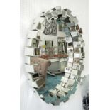 OVAL MIRROR, with crenulated mirrored surround, 107cm x 79cm.