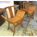 CHINESE CHAIRS, a pair, elm with curved rattan seats on splayed supports, 75cm W x 93cm H.