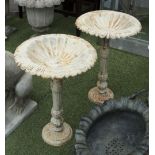 VICTORIAN STYLE CAST IRON BIRDBATHS, a pair, in a cream finish with egg and dart bowl, 38cm x 58cm.