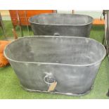 PLANTERS, a pair, oval in a leaded finish, 50cm x 100cm x 50cm H.