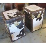 TRUNKS, two, cowhide and partly leather bound with a square rising top enclosing storage space,