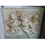 PLASTERCAST RELIEF, 20th century, polychrome, depicting a trio of cherub figures, 100cm x 84cm.