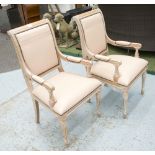 DINING CHAIRS, a set of ten, limed oak, with cream padded seat, back and arms, 53cm W.
