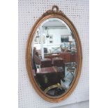 OVAL GILT FRAMED WALL MIRROR, 79cm H x 47cm W overall.