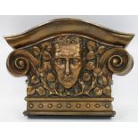 BRONZE CAPITAL, Art Deco cast as a mask amongst leaves and scrolls, 26cm H x 47cm x 19cm.