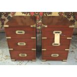 BEDSIDE CHESTS, a pair, Campaign style mahogany and brass bound each with three drawers,