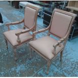 DINING CHAIRS, a set of twenty, limed oak, with cream padded seat, back and arms, 53cm W.