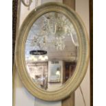 WALL MIRROR, Louis XVI style grey painted with oval decorative frame and bevelled plate,
