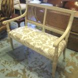 CANAPÉ, early 20th century French grey painted, caned and panelled back, linen upholstered,