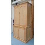 DRINKS CABINET, in limed oak, with mirrored back and three shelves above cupboard below,
